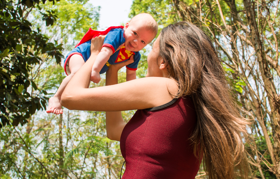 Woman lifting super-baby